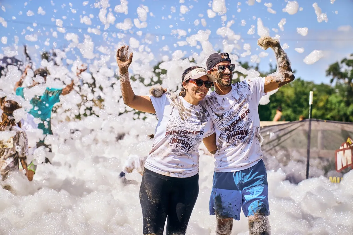 Volunteers celebrating in the foam at an EventLab run